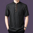 Men's black 100% silk henley shirt featuring a stand collar with subtle bronze embroidery, paired with black trousers.