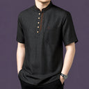 Close-up view of the black silk henley top, highlighting the four-button placket and single chest pocket.