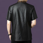 Back view of the black silk shirt, showing the clean, relaxed drape and the continuation of the bronze jacquard collar detail at the nape.