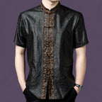 Men's black 100% mulberry silk short-sleeve shirt featuring a contrasting bronze jacquard placket with traditional frog buttons and a stand collar.