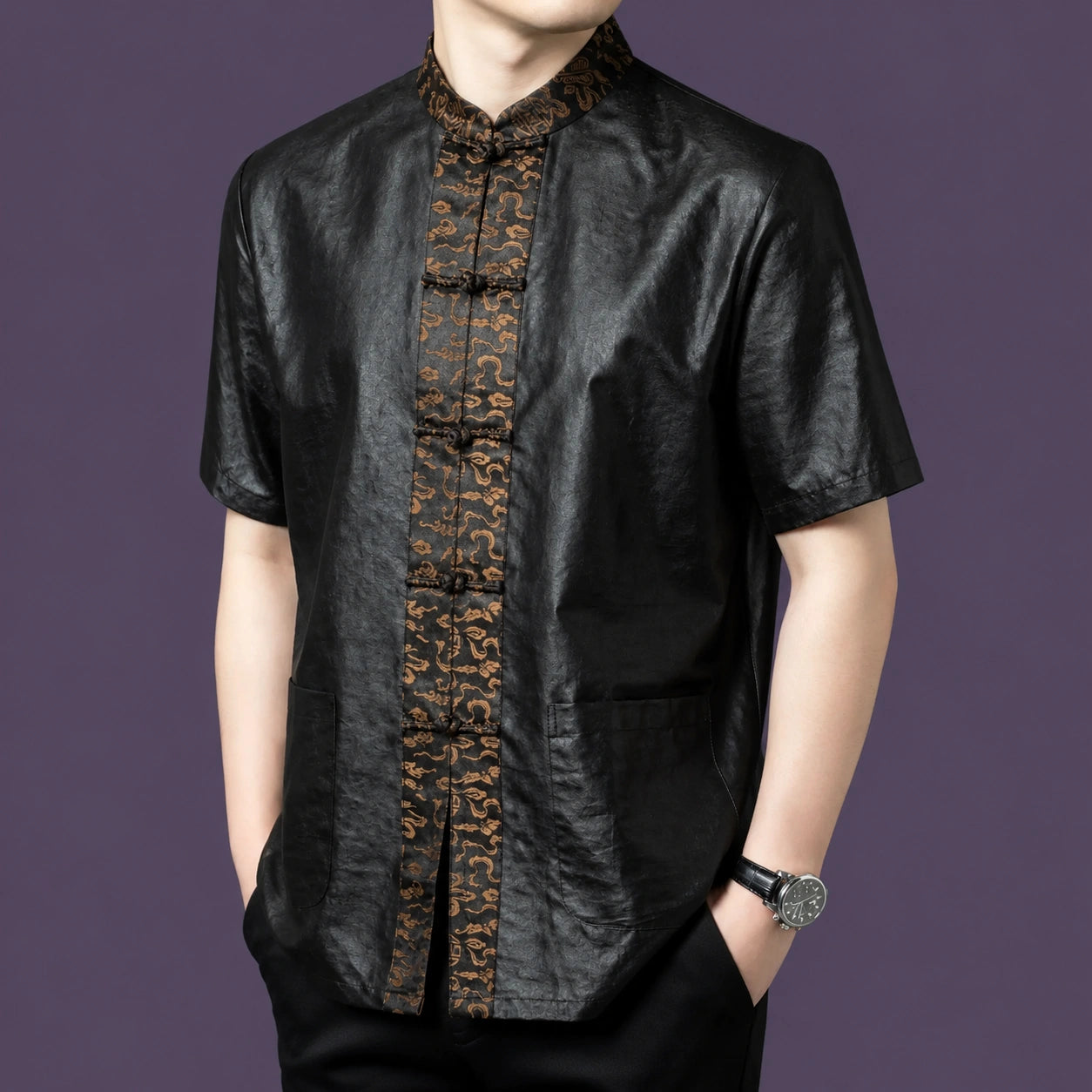 Front view of a black silk shirt with a textured body and a detailed embroidered jacquard panel running down the center.
