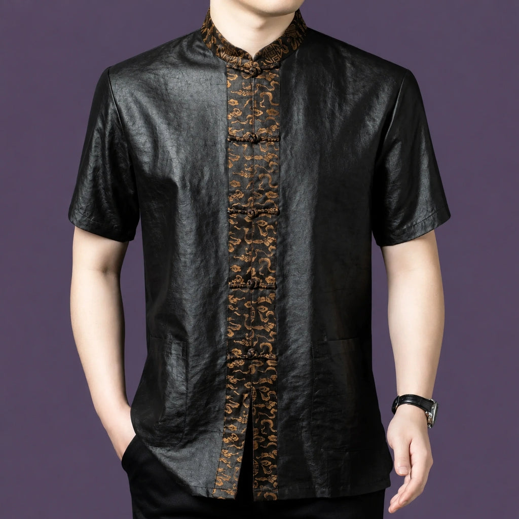 Men's relaxed-fit black silk top with a stand collar and a distinct contrasting patterned placket that stands out against the dark fabric.