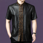 Men's relaxed-fit black silk top with a stand collar and a distinct contrasting patterned placket that stands out against the dark fabric.