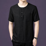 Front view of the black silk short-sleeve top, highlighting the textured crinkled finish and the relaxed, straight cut.