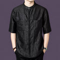 Front view of the black silk shirt showcasing the hidden placket and natural crinkled texture.