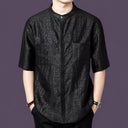 Front view of the black silk shirt showcasing the hidden placket and natural crinkled texture.