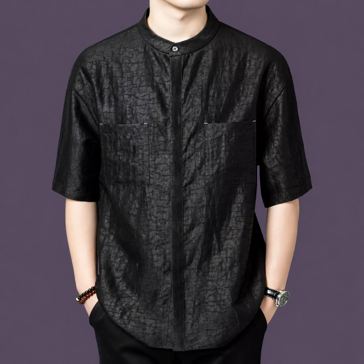 Front view of the black silk shirt showcasing the hidden placket and natural crinkled texture.