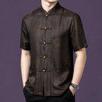 Front view of the brown silk shirt, highlighting the intricate woven texture and two front patch pockets.