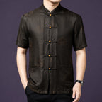 Men's relaxed-fit silk top with a classic mandarin collar and a row of dark knot buttons with wooden bead accents.