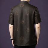 Back view of the dark brown silk shirt, showcasing the consistent geometric jacquard weave and scattered floral motifs across the entire fabric.