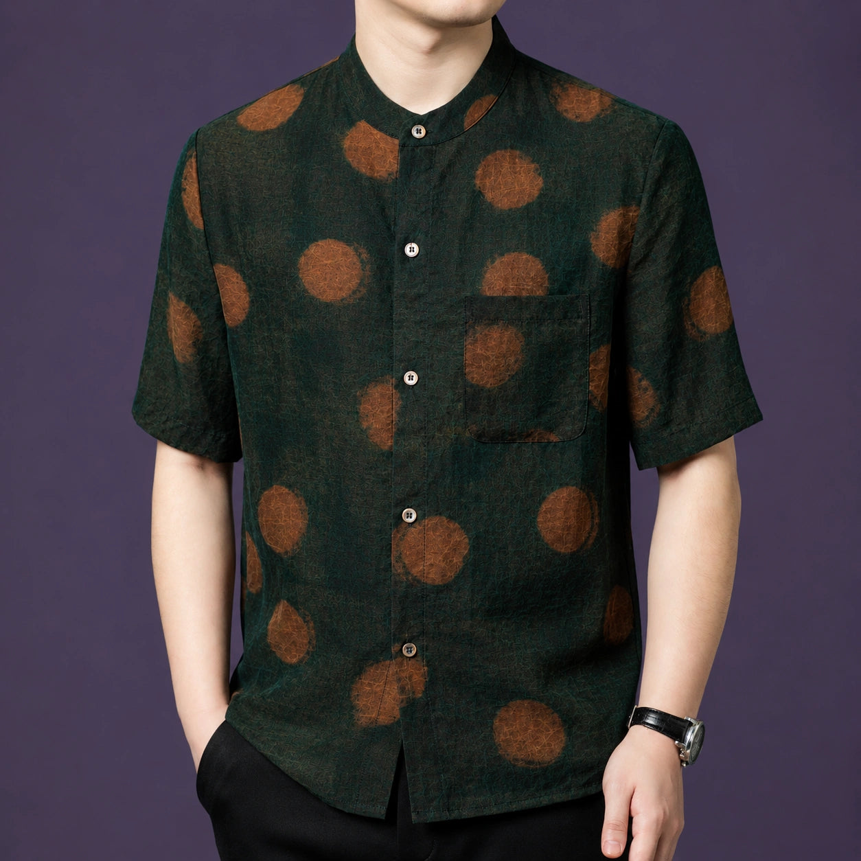 Men's dark green silk shirt with a classic button-down front placket and a painterly, watercolor-style dot print.