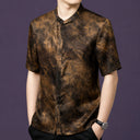 Front view of the textured silk shirt, highlighting the relaxed straight cut and the natural swirling pattern on the fabric.