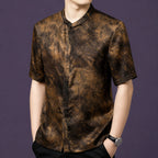 Front view of the textured silk shirt, highlighting the relaxed straight cut and the natural swirling pattern on the fabric.