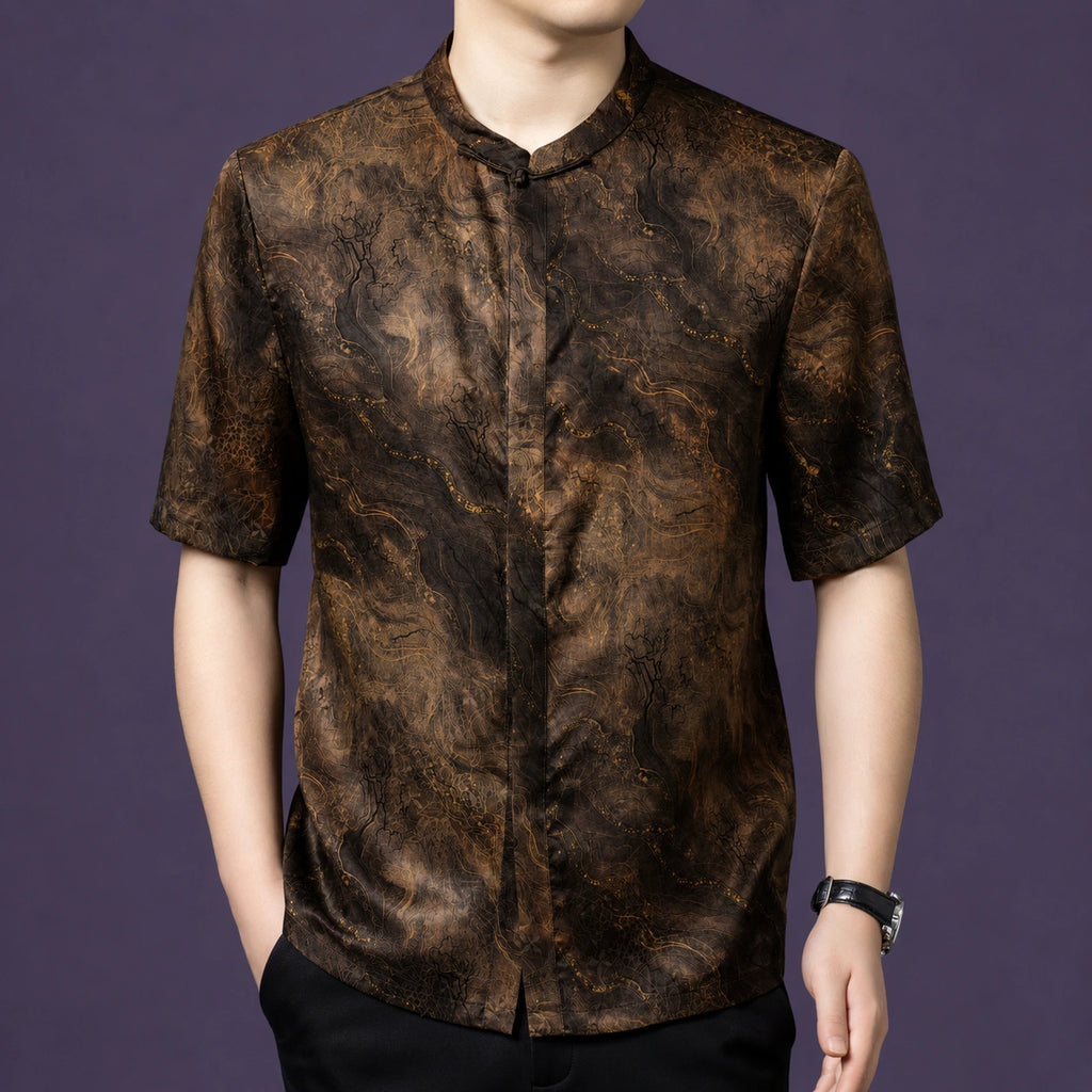 Men's short-sleeve silk top with a stand collar, showcasing the marble-like flow of the fabric and the clean buttonless front.