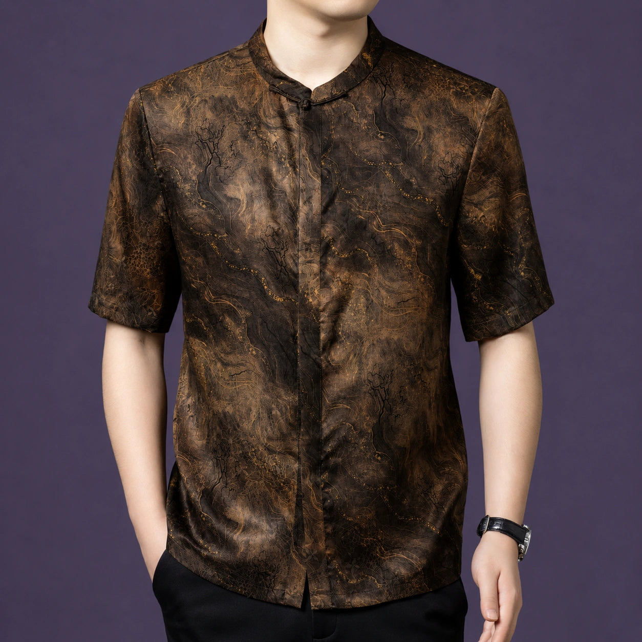 Men's short-sleeve silk top with a stand collar, showcasing the marble-like flow of the fabric and the clean buttonless front.