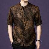 Men's short-sleeve silk top with a stand collar, showcasing the marble-like flow of the fabric and the clean buttonless front.