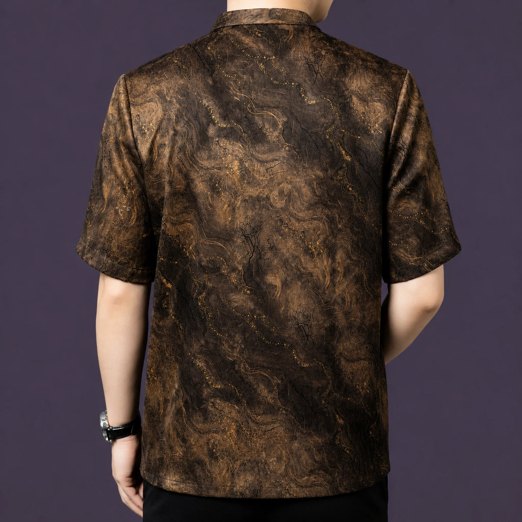 Back view of the marble-patterned silk shirt, showing the straight, relaxed silhouette and the continuous texture across the back panel.
