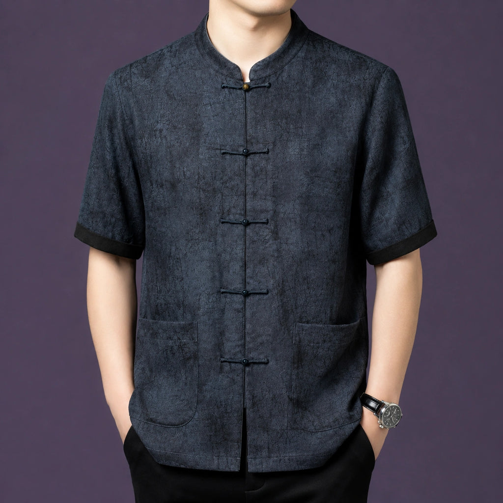 Men's charcoal grey 100% mulberry silk short-sleeve shirt with a stand collar, front patch pockets, and traditional frog button closures.