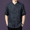 Men's charcoal grey 100% mulberry silk short-sleeve shirt with a stand collar, front patch pockets, and traditional frog button closures.