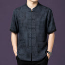 Men's charcoal grey 100% mulberry silk short-sleeve shirt with a stand collar, front patch pockets, and traditional frog button closures.