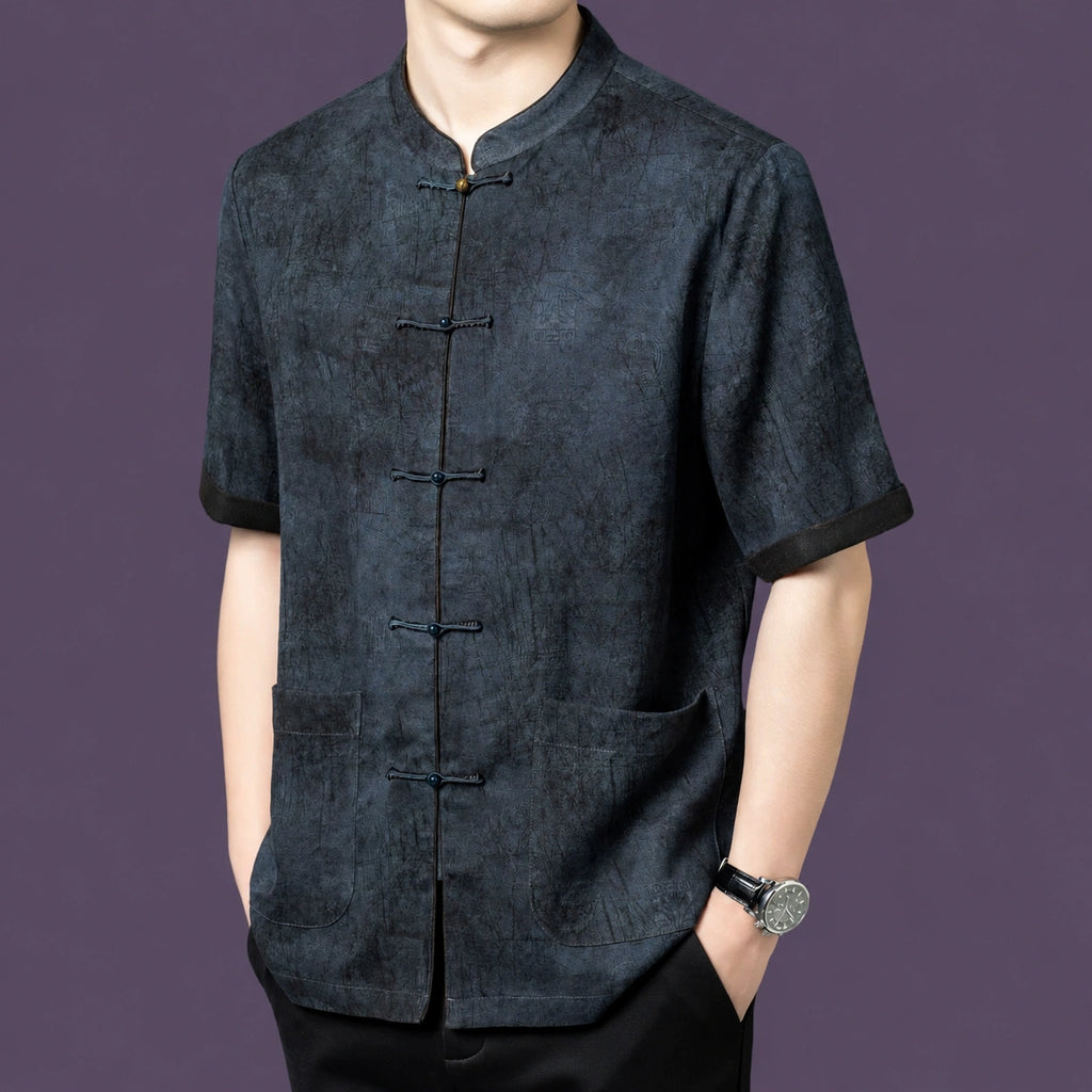 Front view of the grey silk shirt, highlighting the unique washed, crinkled texture and contrast cuffs.