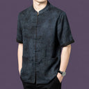 Front view of the grey silk shirt, highlighting the unique washed, crinkled texture and contrast cuffs.