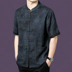 Front view of the grey silk shirt, highlighting the unique washed, crinkled texture and contrast cuffs.