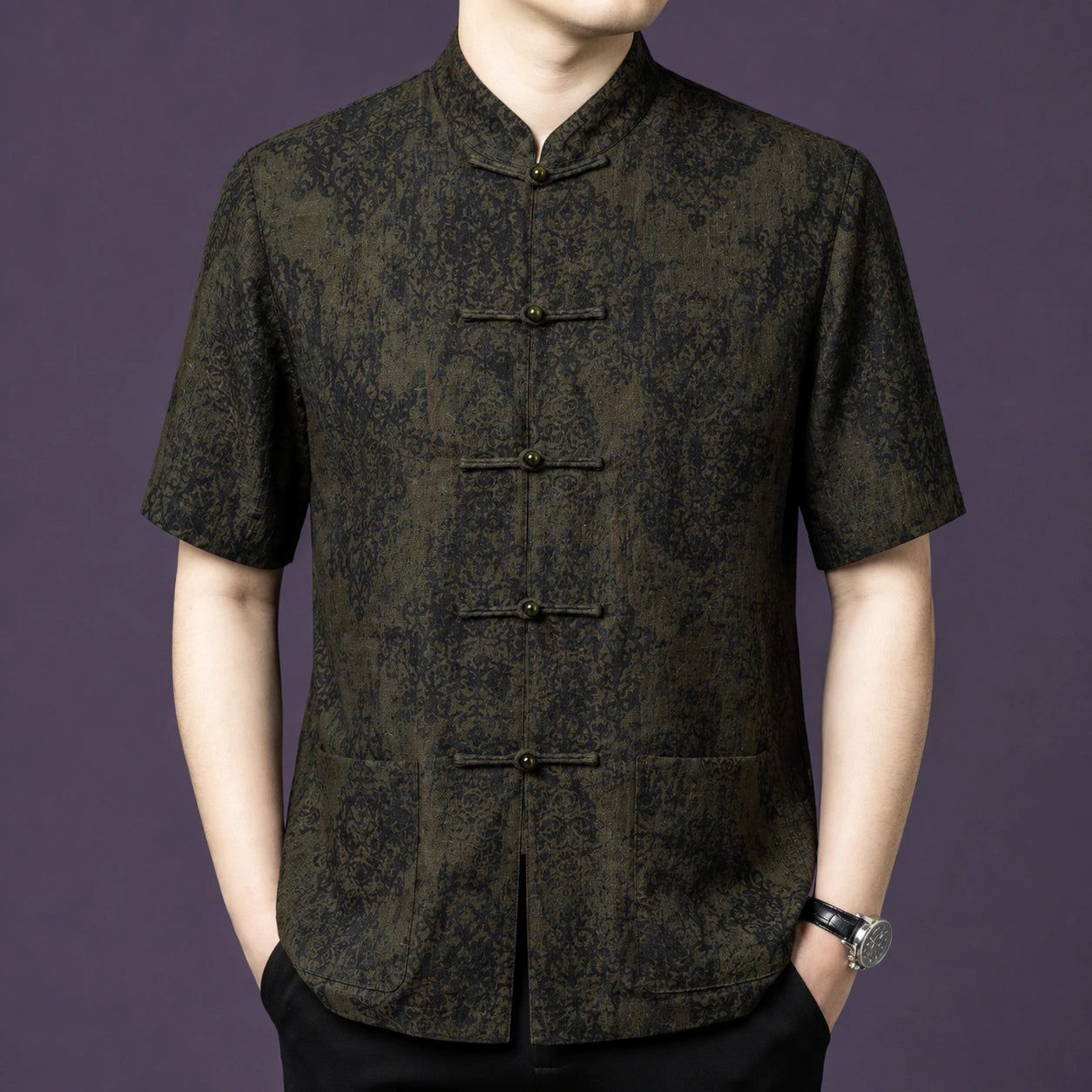 Front view of a man wearing a 100% mulberry silk mandarin collar short sleeve shirt with classic frog buttons.