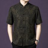 Front view of a man wearing a 100% mulberry silk mandarin collar short sleeve shirt with classic frog buttons.