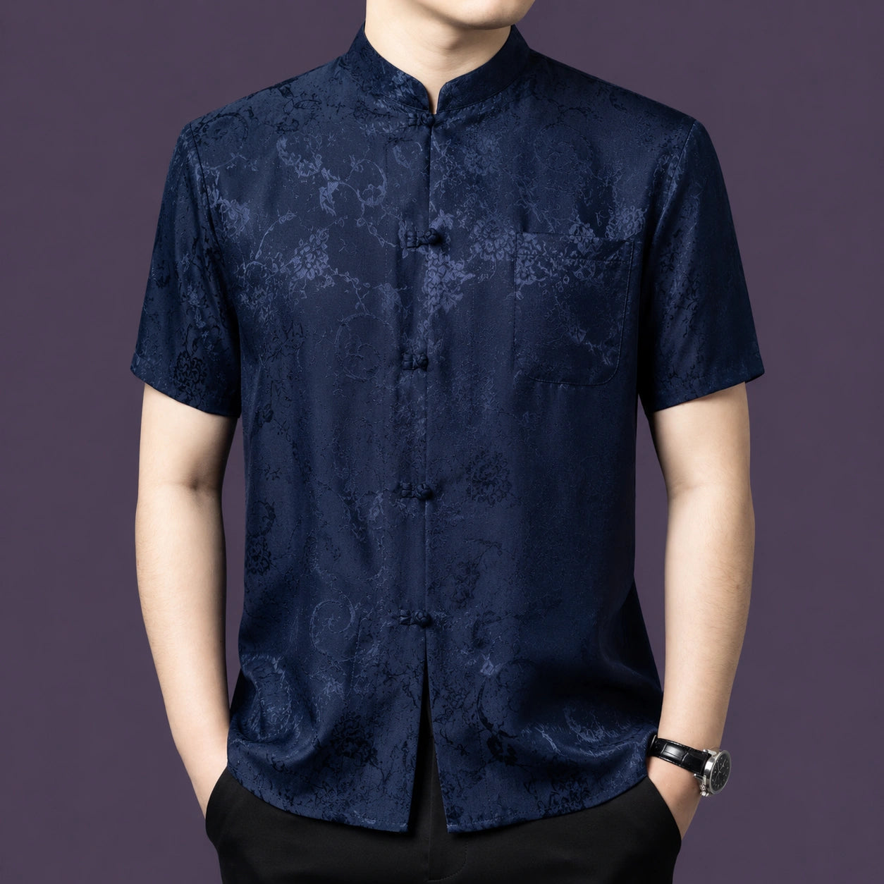 Men's navy blue 100% mulberry silk short-sleeve shirt with a traditional stand collar and a single patch pocket, featuring a tonal floral jacquard weave.