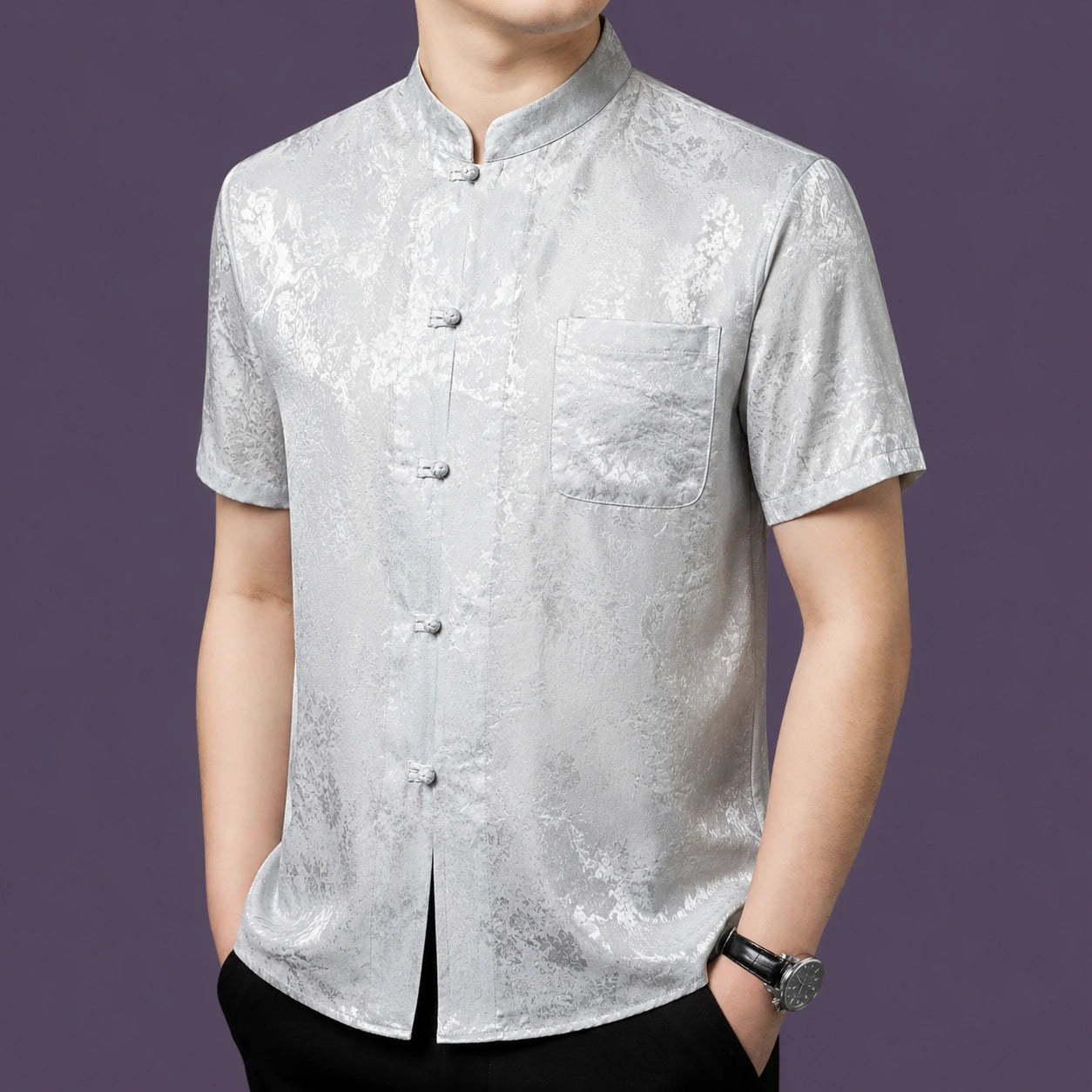 Alternate angle of the men's silver-grey silk shirt, highlighting the fine details of the button placket and the subtle light-reflecting jacquard pattern.