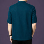 Back view of the teal silk shirt, showcasing the natural drape and subtle crinkled texture across the back panel.