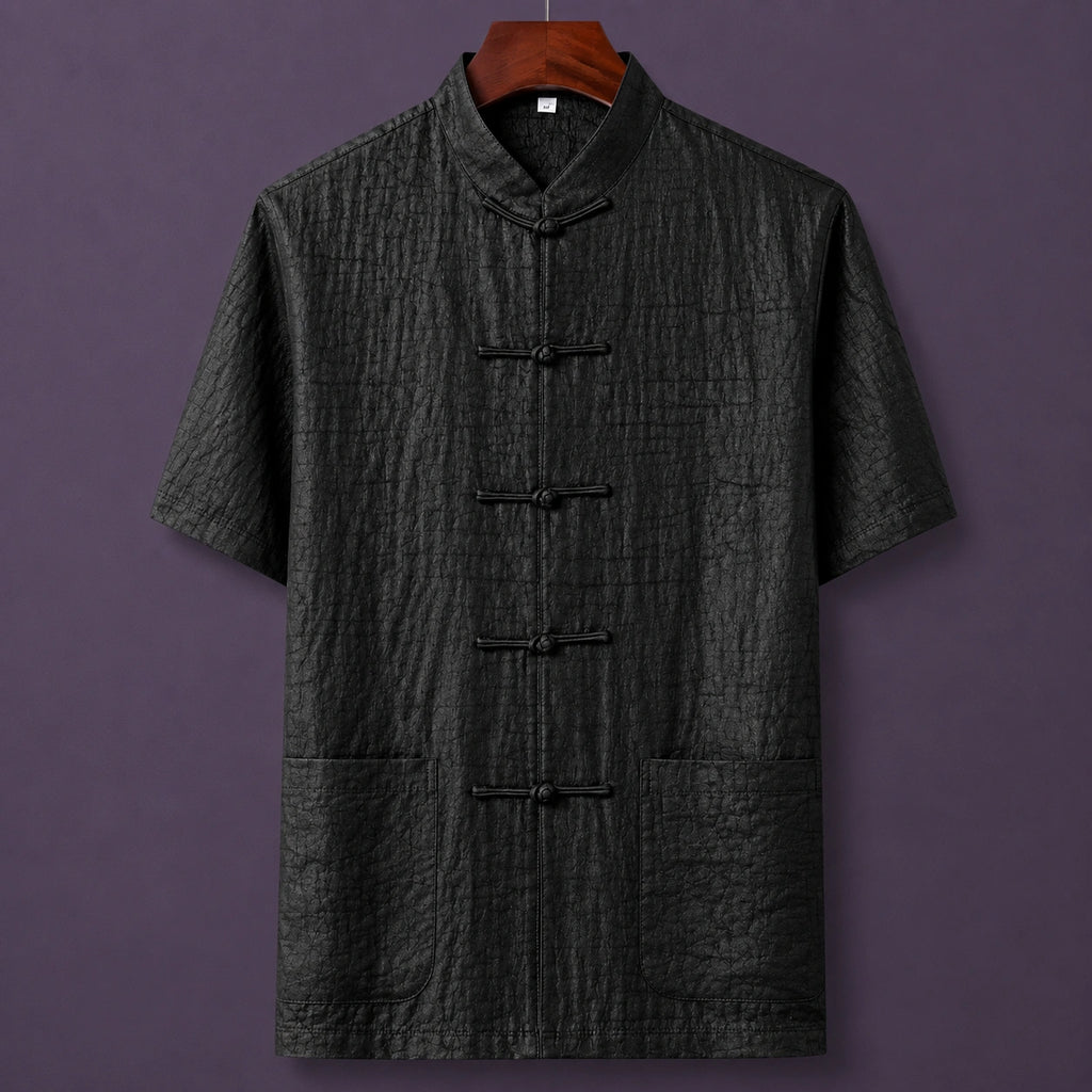 Men's black 100% mulberry silk mandarin collar short sleeve shirt with traditional frog button closure.