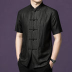 Side view of a men's black mulberry silk short sleeve shirt with mandarin collar and traditional frog button closure.