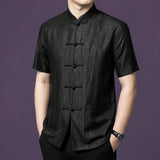 Side view of a men's black mulberry silk short sleeve shirt with mandarin collar and traditional frog button closure.