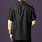 Back view of a men's black 100% mulberry silk mandarin collar short sleeve shirt.