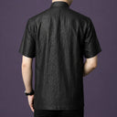 Back view of a men's black 100% mulberry silk Mandarin collar short sleeve shirt.
