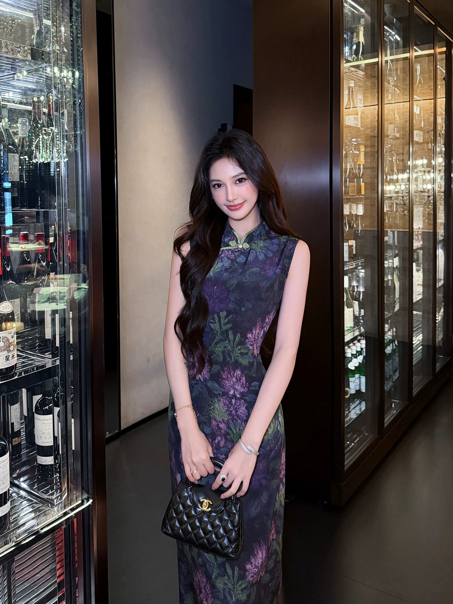 Portrait of a woman wearing a Midnight Botanical Mulberry Silk floral Cheongsam dress.