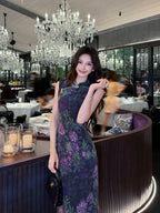 Lifestyle image of a Midnight Botanical Mulberry Silk floral Cheongsam dress in an elegant dining setting.