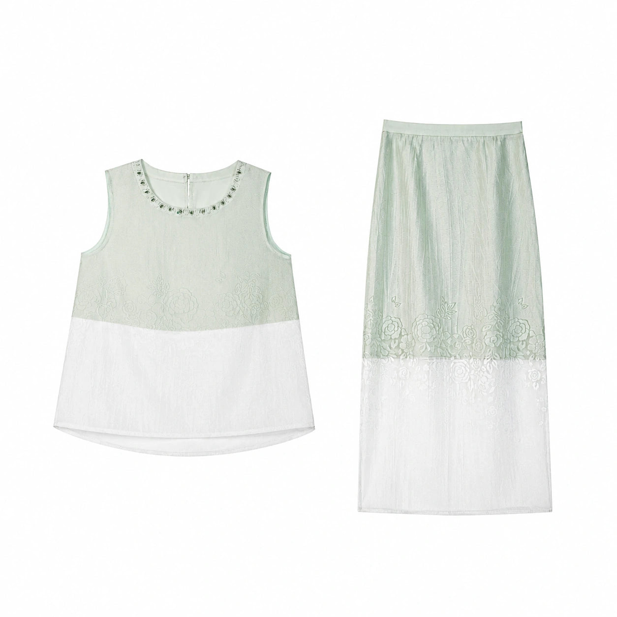 Flat lay of a mint green two-piece set featuring a sleeveless top with beaded trim and a matching midi skirt with embroidered floral details and a sheer white hem.