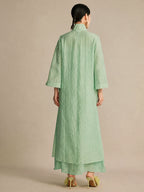 Back view of the mint green long dress, highlighting its relaxed, straight drape and the subtle layered hem detail at the bottom.