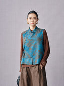 Front view of a mist blue Lyocell jacquard vest with diagonal closure and mandarin collar