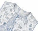 Close-up of the round neckline, decorative knot, blue button and piped edge.