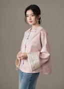 Model wearing the embroidered jacquard jacket with jeans, angled view