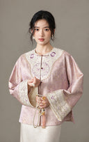 Front view of the model wearing the jacket with a light-colored skirt