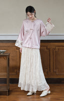 Full-length view of a model styling the misty lavender jacket with a flowing ivory skirt.