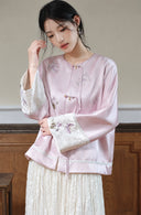Model wearing the relaxed misty lavender jacket, highlighting its embroidered front and wide ivory cuffs.