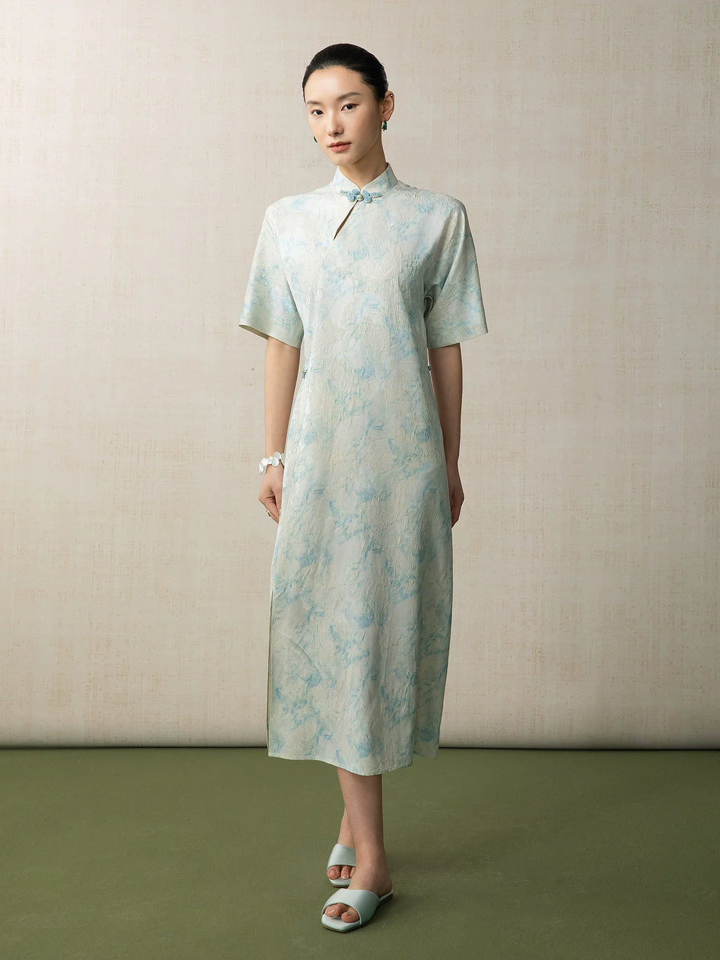 Full-length view of a relaxed fit light blue Chinese style midi dress