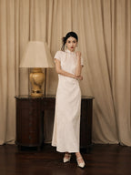 Women's ivory modern jacquard qipao dress with mandarin collar and short sleeves by Gambiered Silk.