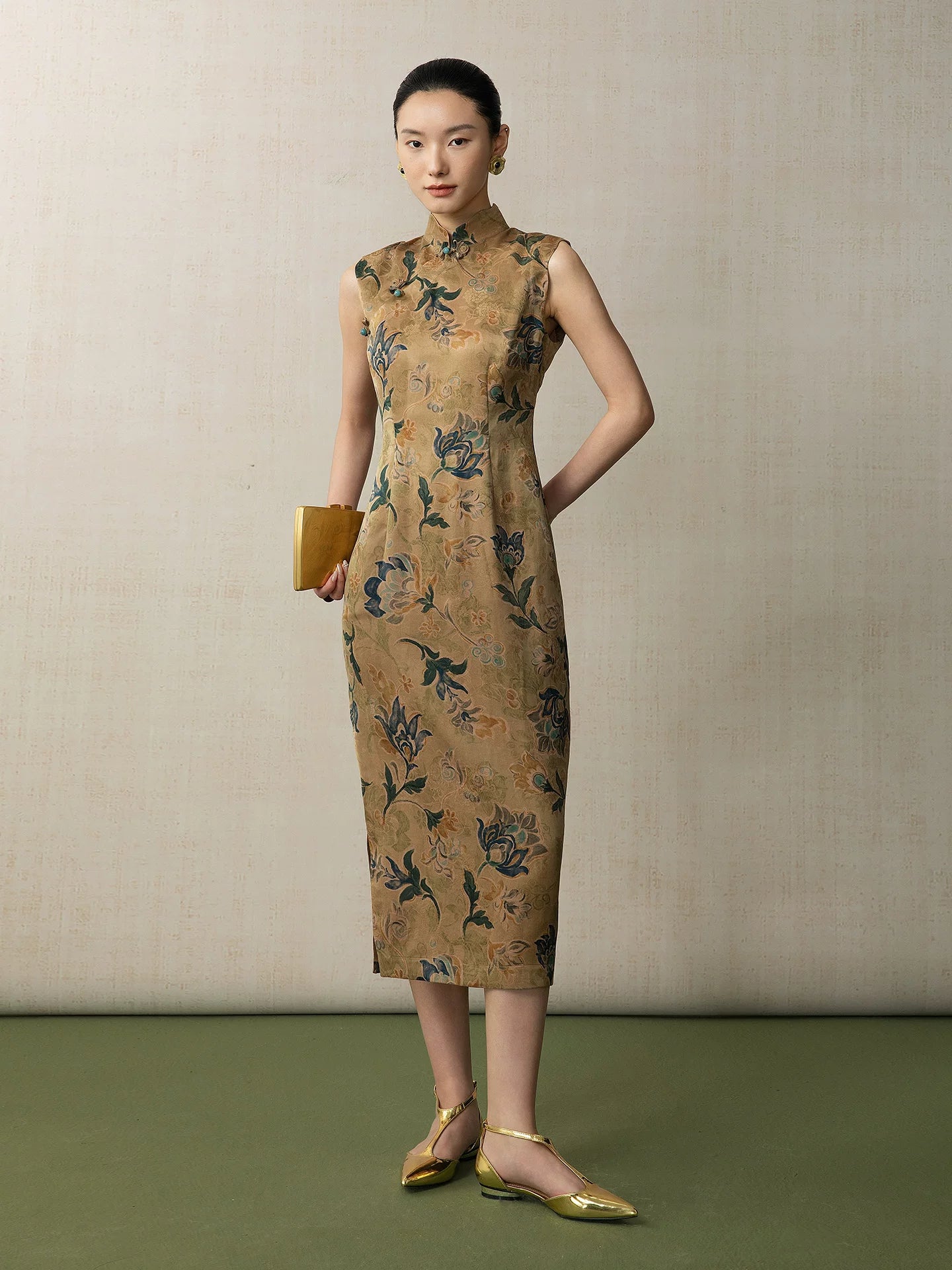 Full length view of a floral silk cheongsam dress in a fitted sleeveless silhouette